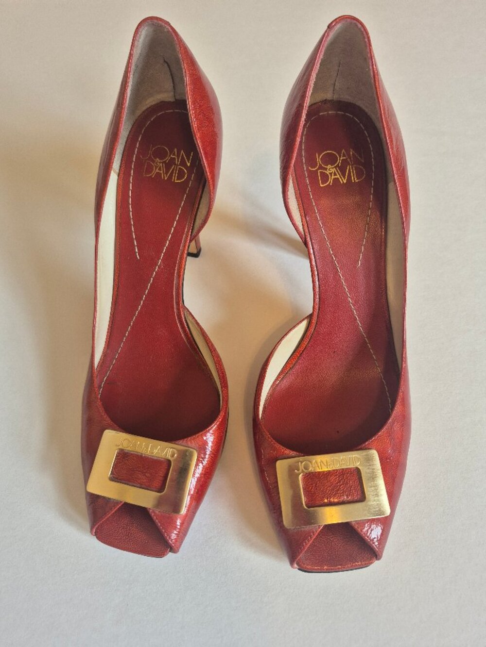 Joan & David patent leather heels with a gold buckle size 7.5